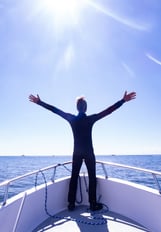 Instructor enjoying the sunshine from the bow of the boat