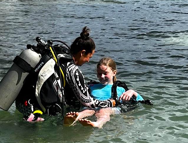 Instructor getting the bubblemaker familiar with her gear